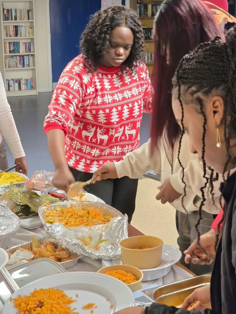 Community meal, plates being served